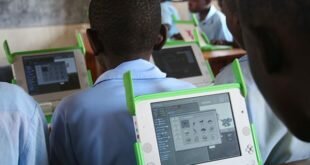 Schoolchildren using laptops